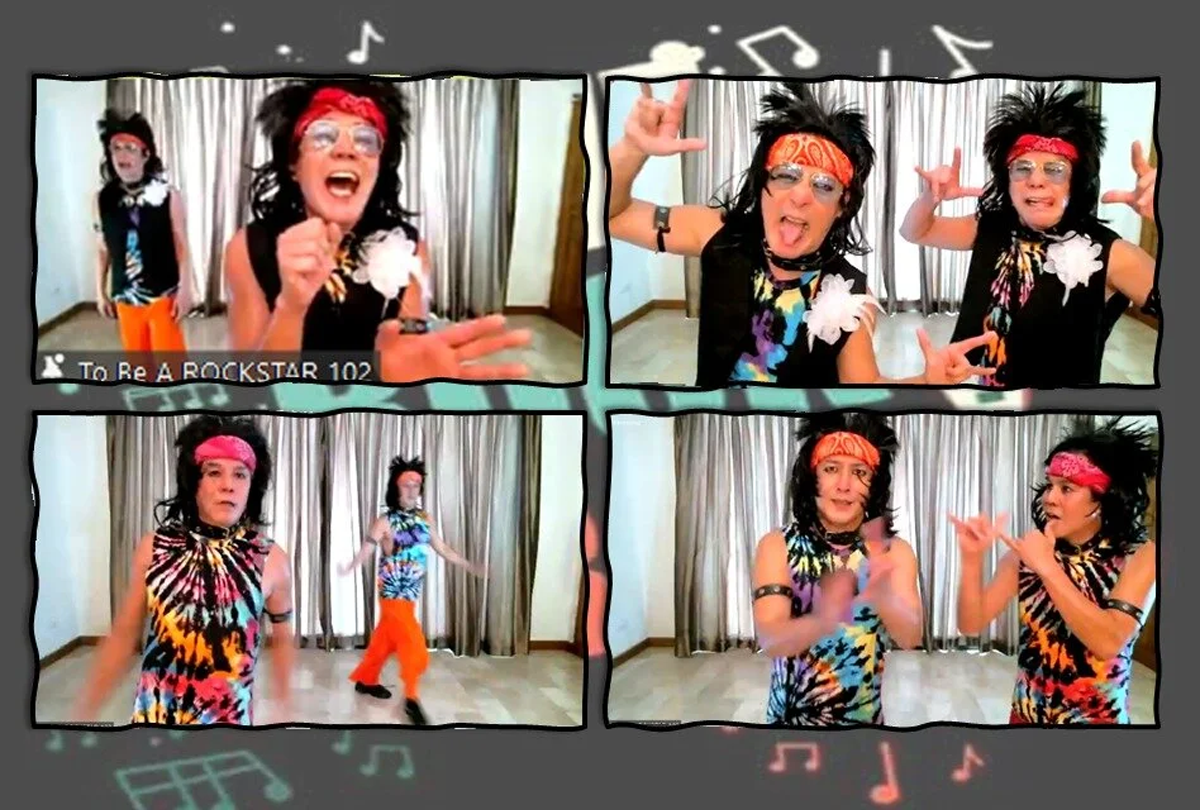 Mullet wig, tie-dye top and eyeliner complete the rock star look